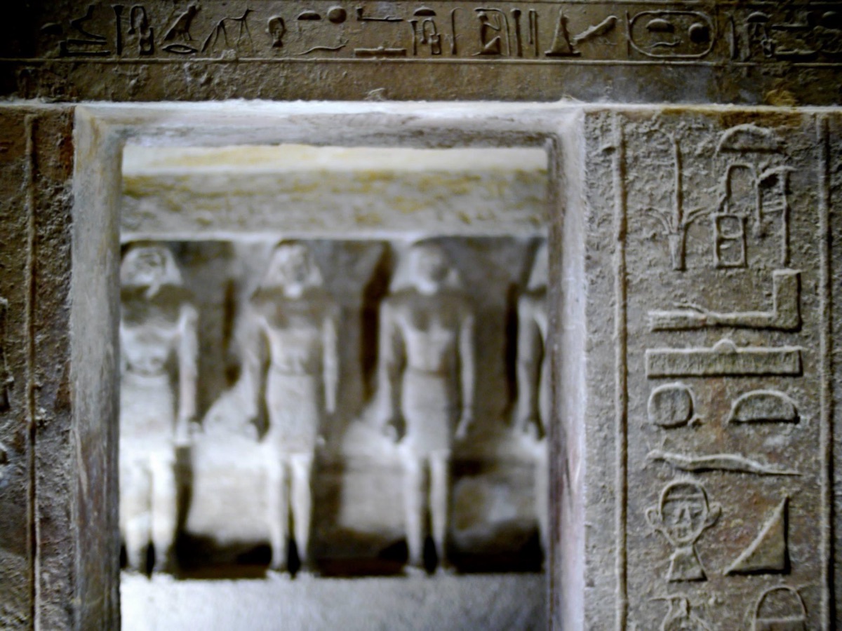 Saqqara — the serdab, figures standing in the dark